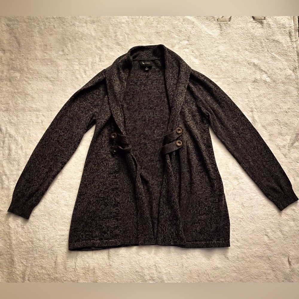 Dark grey, medium length, thick cardigan, with button detailing.